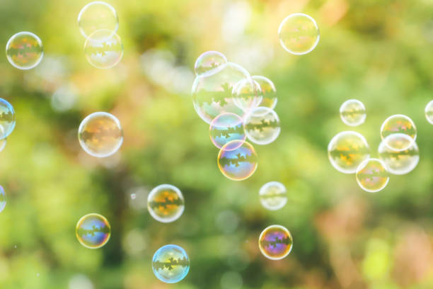 istock soap bubbles on green nature background 1166209532