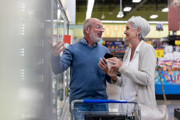 istock Cheerful couple shopping together 1166210253