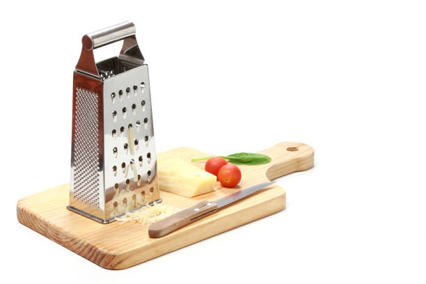 Stainless Steel Cheese Grater on Cutting Board