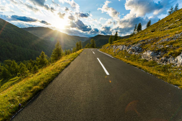 istock Asphalt road in Austria, Alps in a summer day. 1166212560