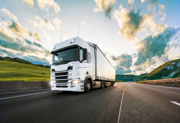 istock Truck with container on road, cargo transportation concept. 1166212562