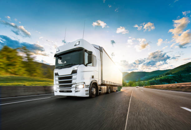 istock Truck with container on road, cargo transportation concept. 1166212615