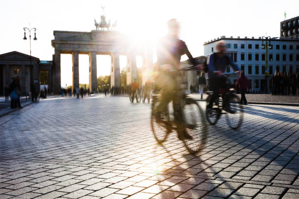 istock Berlin - People cycling at Brandenburg Gate 1166214140