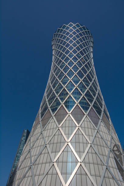 istock Financial success concept. Modern skyscraper on blue background (Qipco Tower, Tornado Tower), closeup 1166215305