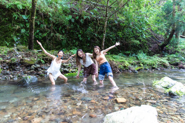 3 women cooling down in cold river