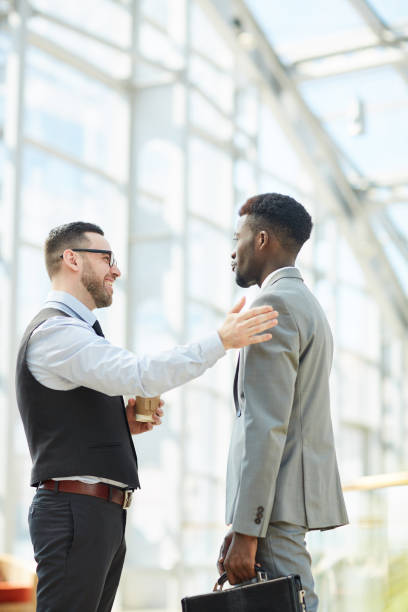 istock Chatting with colleague during coffee break 1166218843