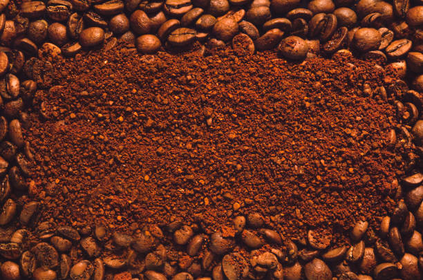 istock Coffee beans and ground powder for background or template. Top view with copy space. 1166219020