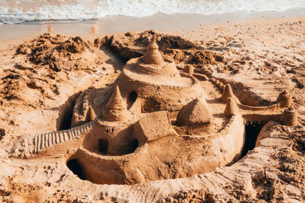 istock sand castle by the sea 1166220136