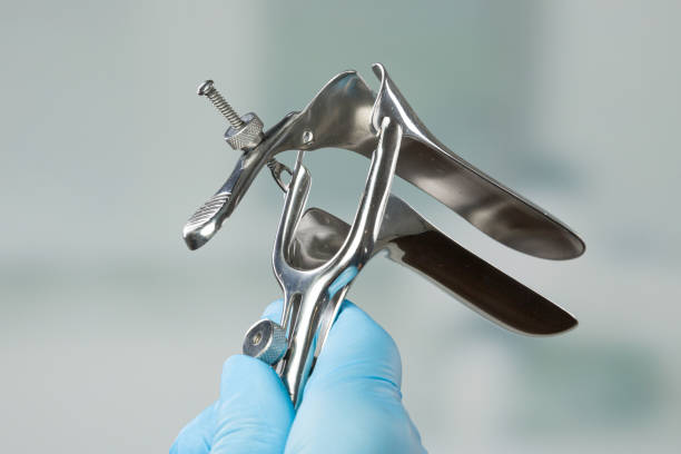 istock Doctor's hand with medical glove holding a speculum 1166220200