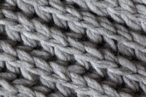 istock Knitted woolen textured surface, macro. Soft grey merino wool pattern backdrop, closeup. Autumn and winter flat lay. Scandinavian minimal style 1166226130