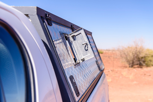 Flap on the side of a pick-up truck canopy, which should be opened when driving on dusty roads to prevent dust being sucked inside.