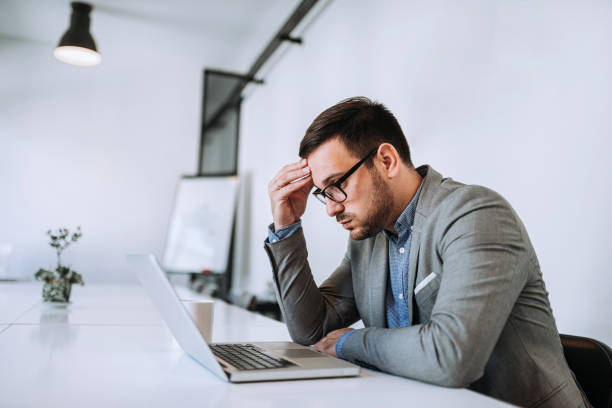 istock Businessman stressed out at work in casual office 1166228186
