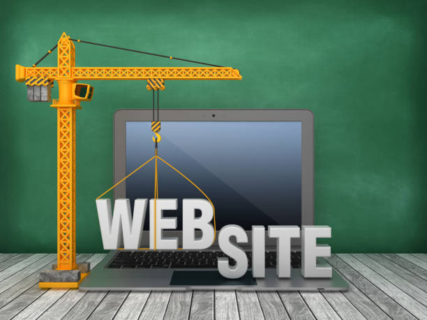 istock Tower Crane and Laptop with WEBSITE Word on Chalkboard Background - 3D Rendering 1166229376