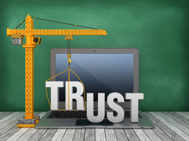 istock Tower Crane and Laptop with TRUST Word on Chalkboard Background - 3D Rendering 1166229378