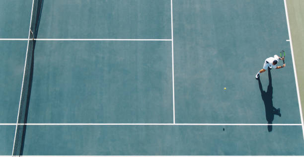 istock Tennis player hitting a backhand on hard court 1166230358