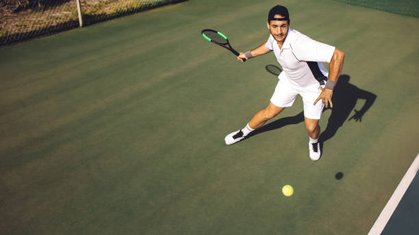 istock Young man in sportswear practicing tennis 1166230434