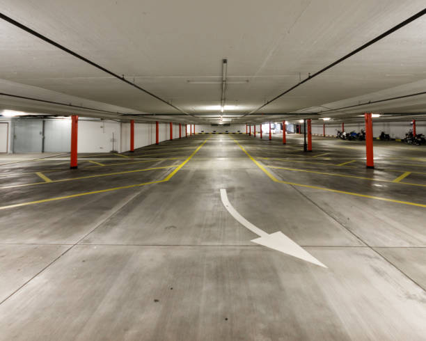 istock Empty illuminated undeground car park wide angle shot 2019 1166240583