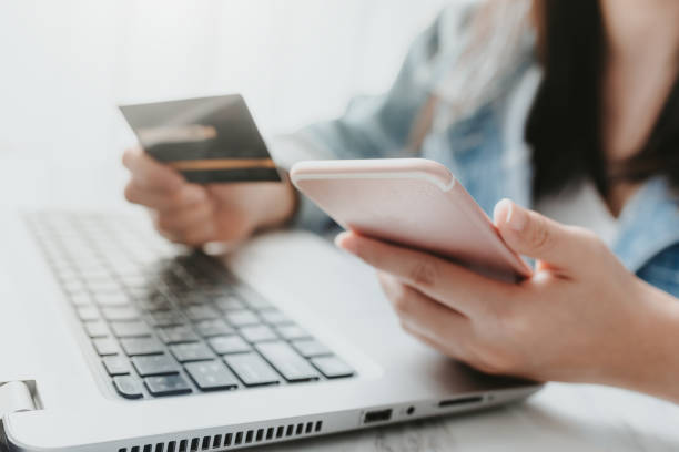 istock hands holding a credit card and using smart phone for online shopping 1166243819