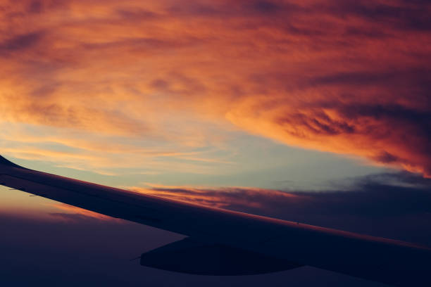 istock Aerial view sunset sky above clouds with dramatic light. View from airplane 1166244310