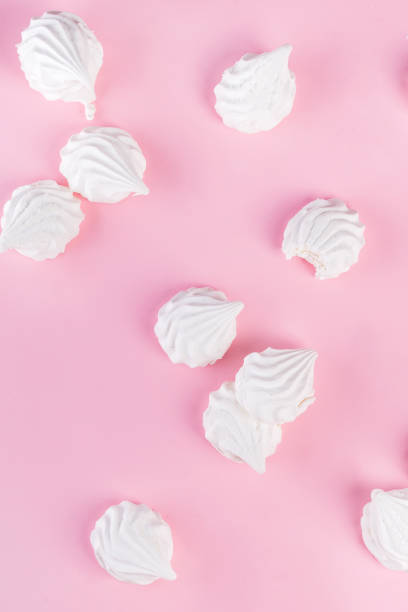 istock Sweet dessert white zephyr marshmallows isolated on pink background 1166247116