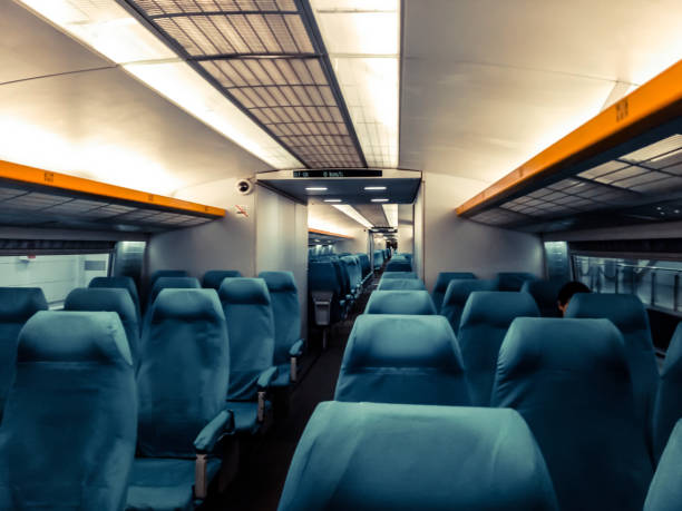 istock Image with the interior of a china border train. A modern train with comfortable and colorful chairs 1166247891