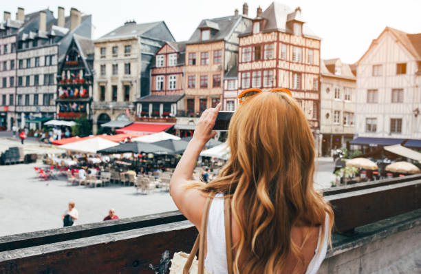 Young woman take photos in Rouen stock photo