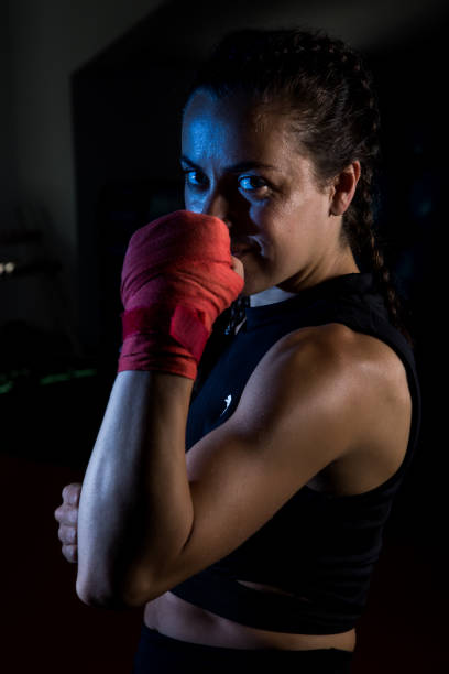 istock Young female boxer prepare for training in a gym. 1166248711