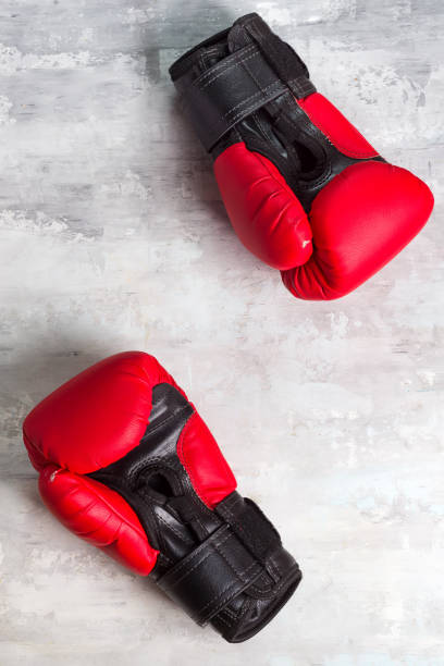 istock Pair red of boxing gloves on grey background, 1166248754