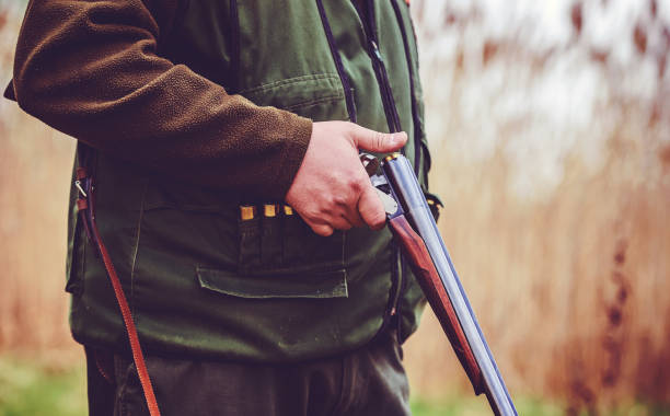 istock Hunter with a rifle in hunting 1166250375