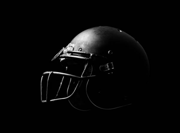 istock Football helmet on black background. 1166251223