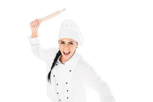istock Aggressive chef in hat holding rolling pin and screaming isolated on white 1166253428