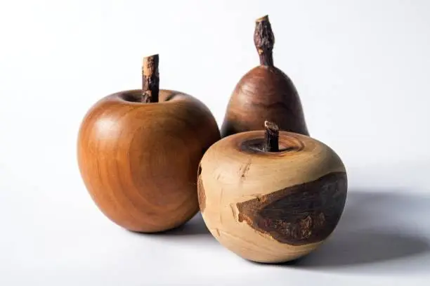 Pear and apple's likeness made of wood - folk art. Christmas table decoration. Tradition