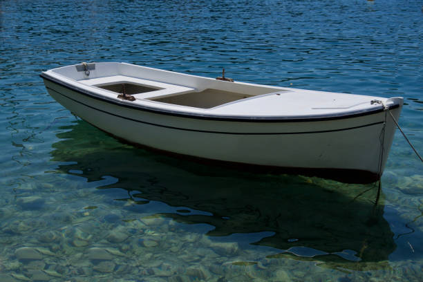 White rowing boat on the turquoise sea