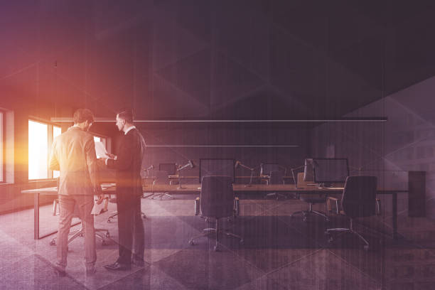 istock Business people in gray office interior 1166255509