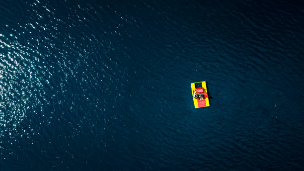 istock catamaran with people on the water top view 1166257840
