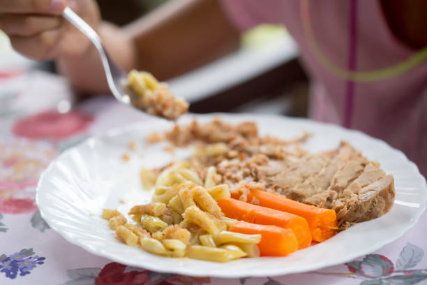 Roasted pork shoulder with buckwheat, cooked beans and carrots