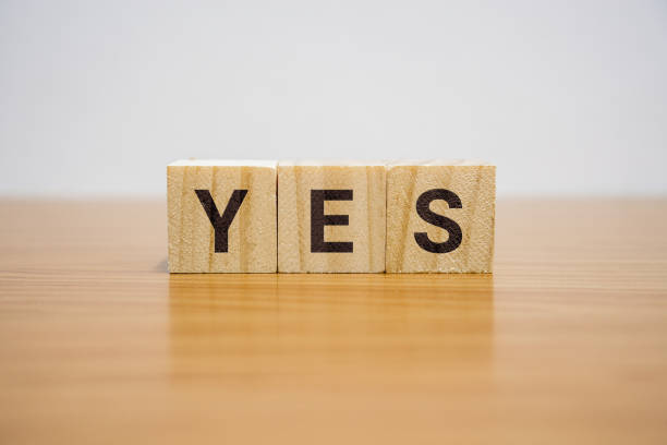 Yes Word on Wooden Block stock photo