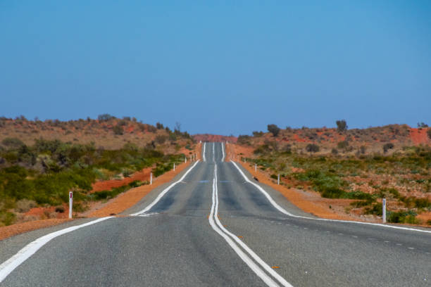 Road straightening up on the way to Coral Bay Western Australia stock photo