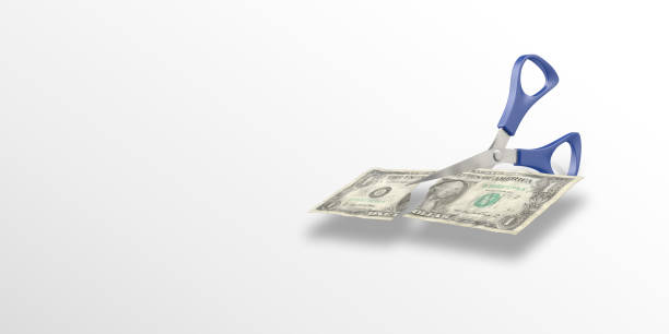 istock American One Dollar Bill is Cutting By A Scissors 1166258933