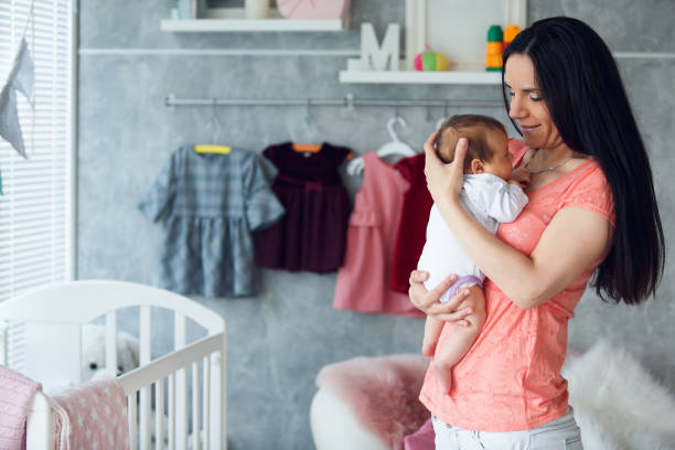 istock Happy mother with her newborn baby 1166258979