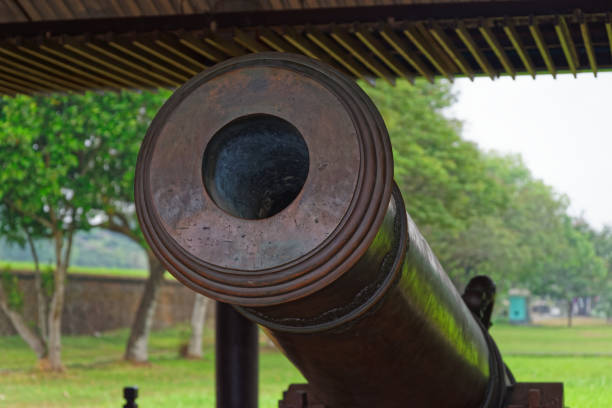 Close-up of an old antique cannon. This cannon is exhibited in a public park located near to Purple Forbidden City (Imperial City) in Hue in Central Vietnam
