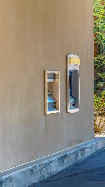 istock Vertical frame Automated Teller Machine built into the exterior wall of a building 1166259791