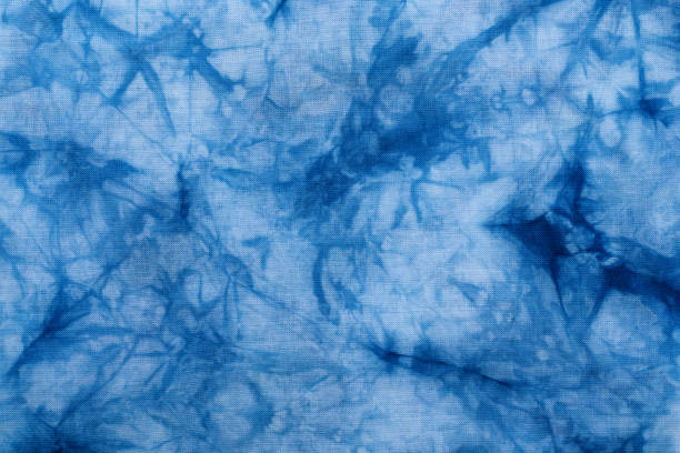 Pattern of blue dye on cotton cloth, Dyed indigo fabric background and textured