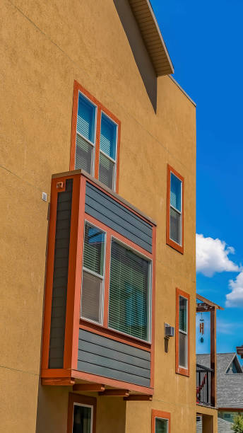 istock Vertical Residential building with a window protruding from the exterior wall 1166260615