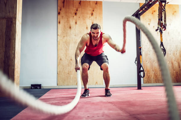 istock Men with rope in functional training fitness 1166261507
