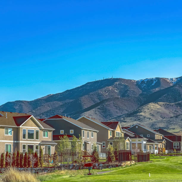 istock Square frame Homes on a residential area on a vast grassy valley viewed on a sunny day 1166262584