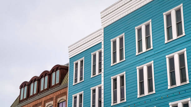 istock Panorama Residential building with blue exterior wall and vertical sliding windows 1166262669