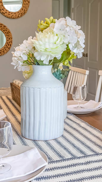 istock Vertical frame Table setting with table runner glasses white plates napkins and flowers 1166262693