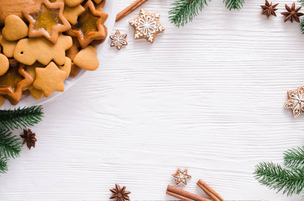 istock Culinary background with freshly baked Christmas gingerbread, spices and fir branches. 1166264689