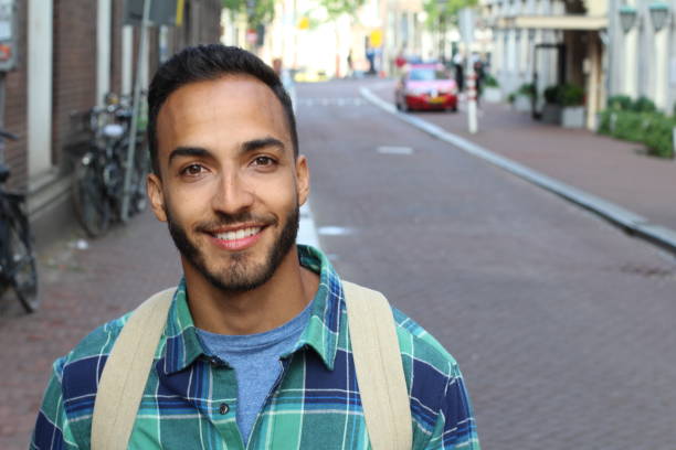 istock Ethnic man smiling on the street 1166264927